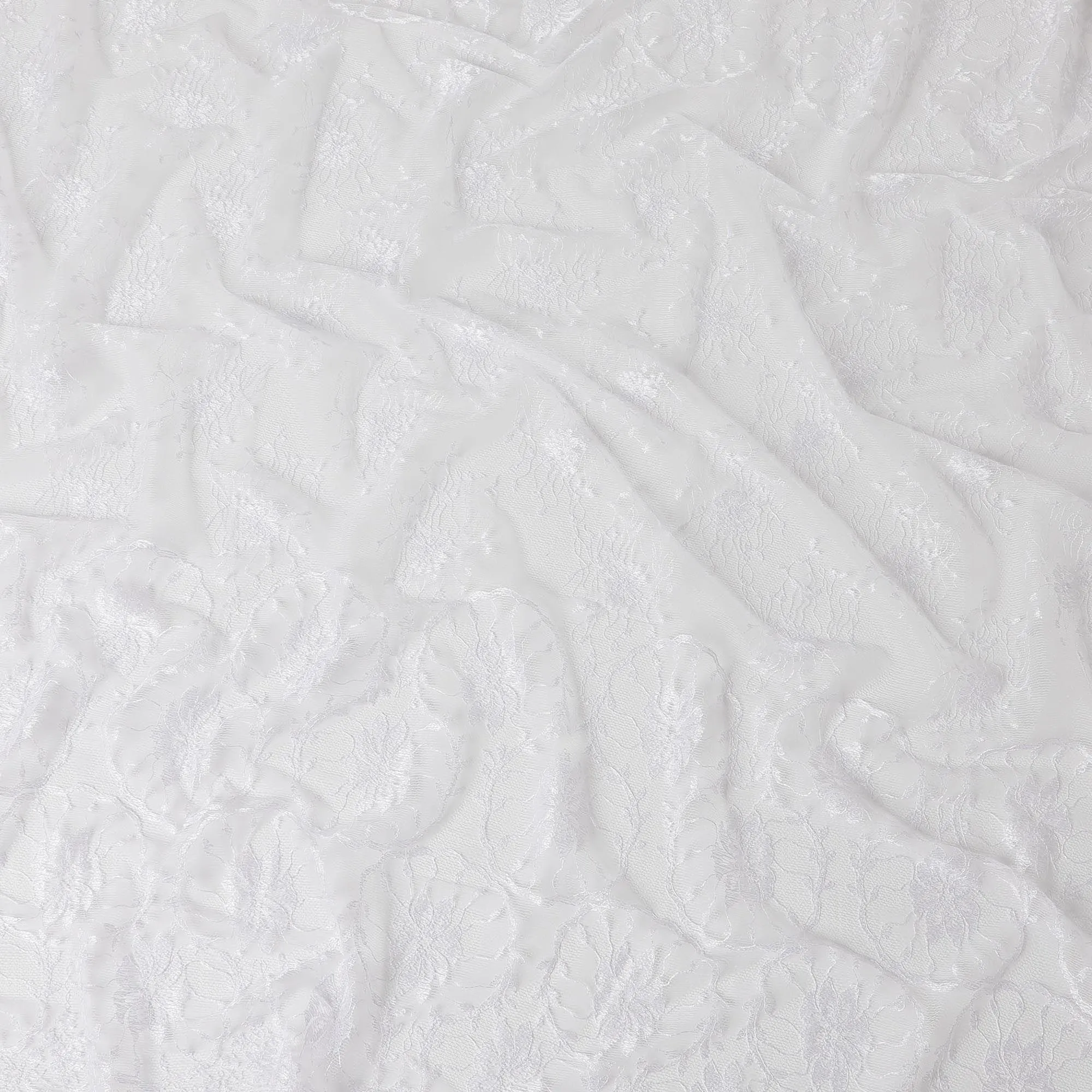 White lace fabric with embroidery in floral design